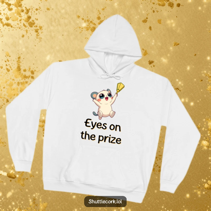 Funny hoodie: a creature with big, round eyes jumps high, reaching for a shuttlecock with ambitious energy.