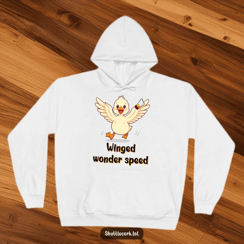 Funny hoodie graphic of an energetic duckling with its wings spread wide, in full pursuit of a shuttlecock.