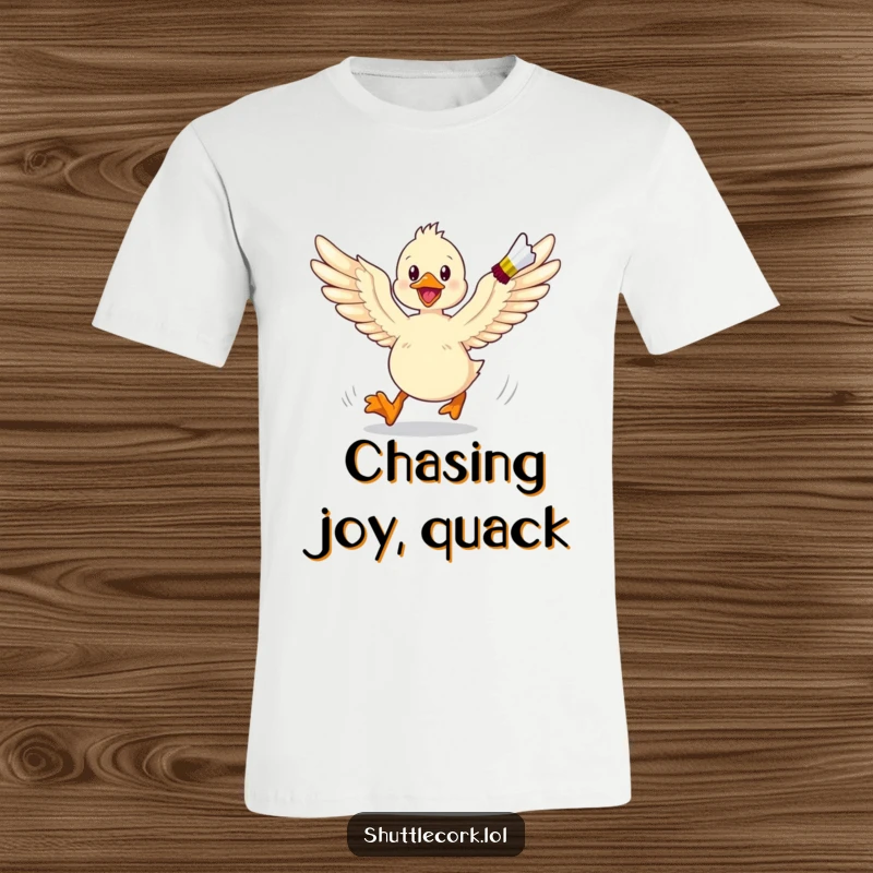 Funny t-shirt design of a duckling with wings spread wide, energetically running and chasing a shuttlecock across a badminton court.